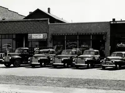 Historic Banjo Equipment Co. store with service trucks, specializing in industrial refrigeration.